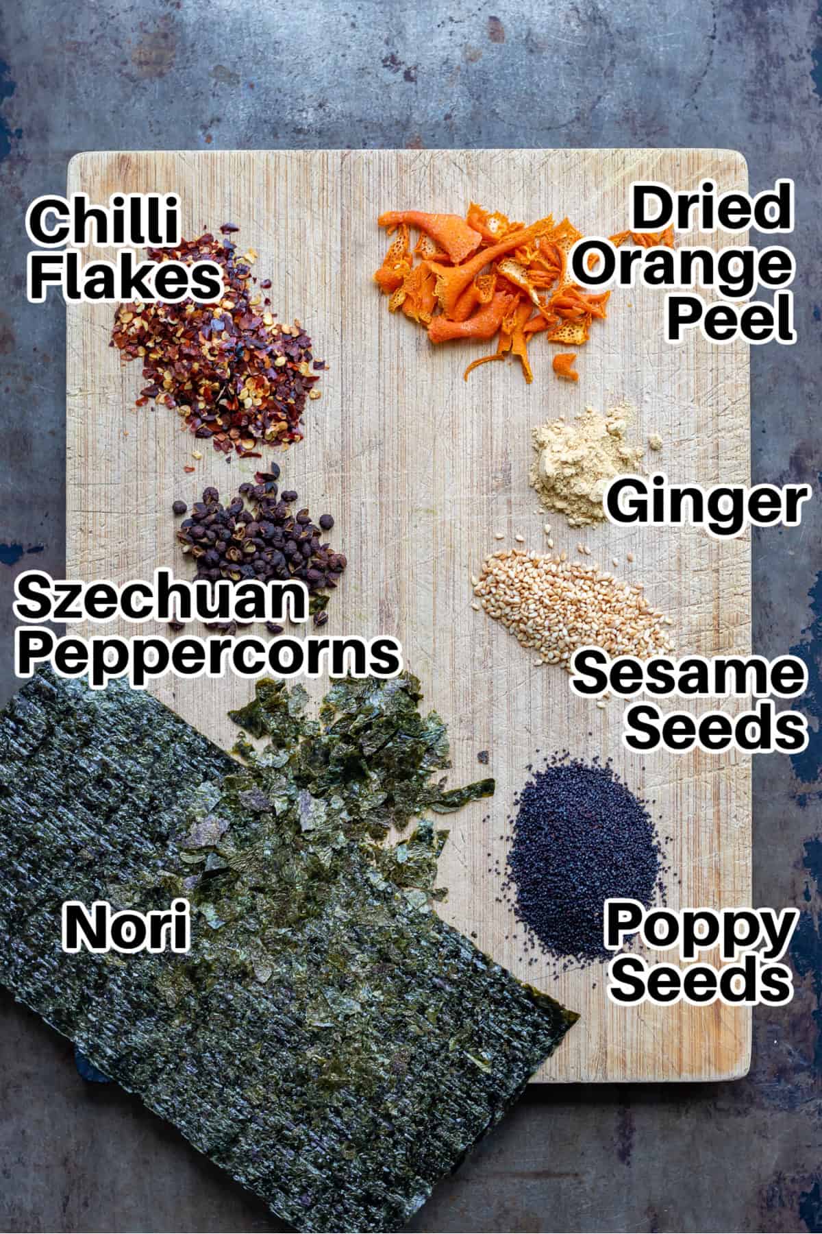 Ingredients on a cutting board on a table.