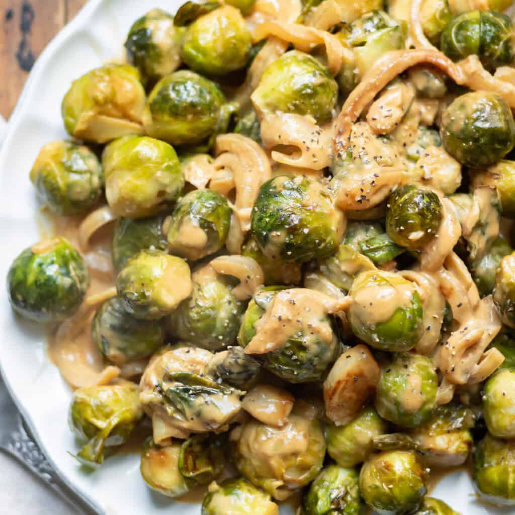 Looking down at a plate of creamy miso brussels sprouts.